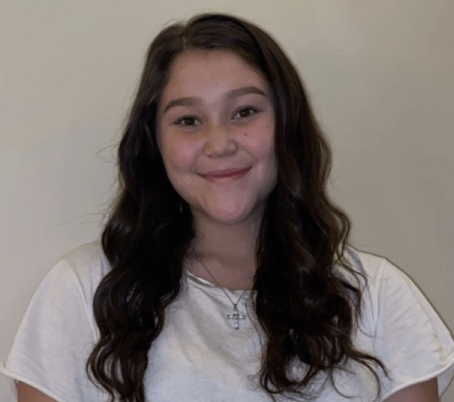 Young woman smiles at camera