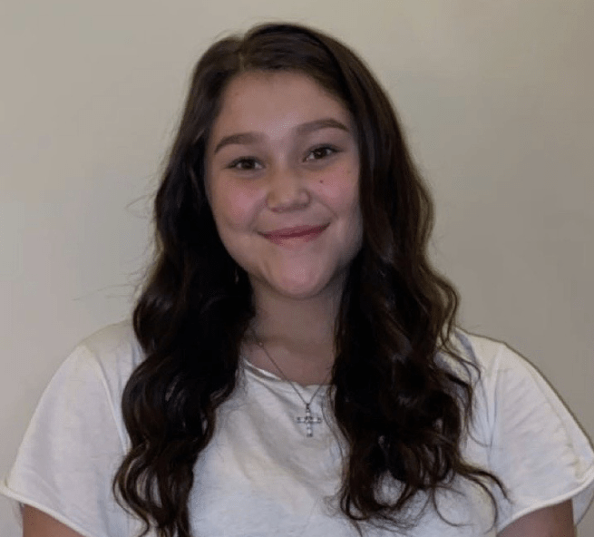 Young woman smiles at camera