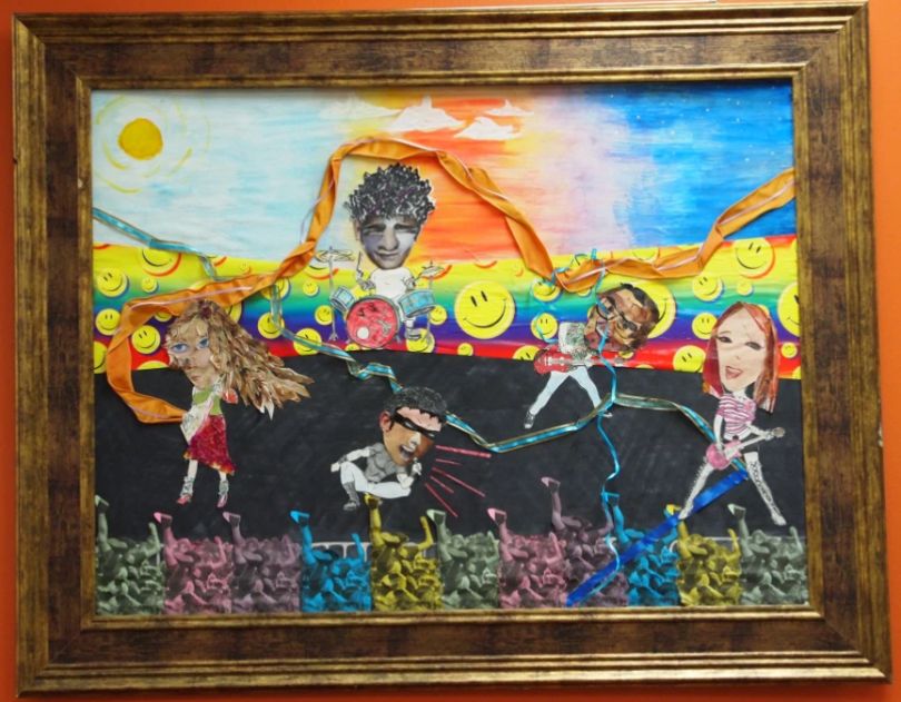 Colorful framed art of people connected by threads.